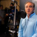 David Shulkin speaking into microphone in podcast studio