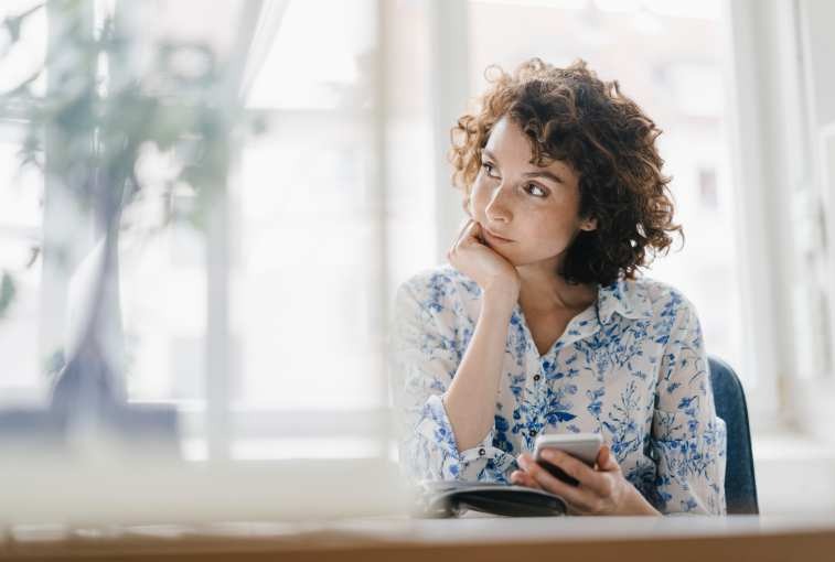 businesswoman in office looking sad