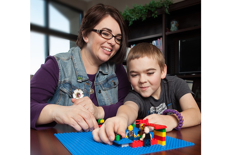 Mother and son happy playing legos