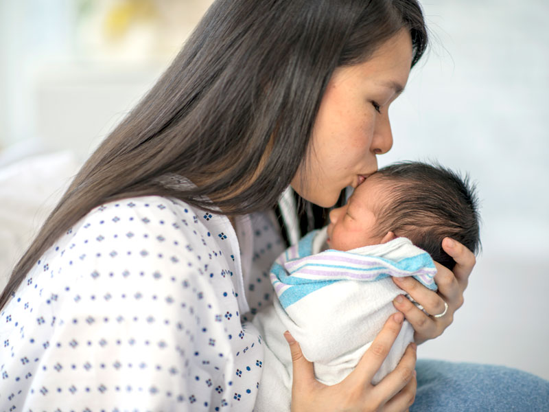 newborn baby with mother