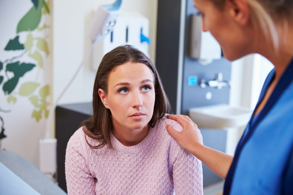 woman talking to nurse