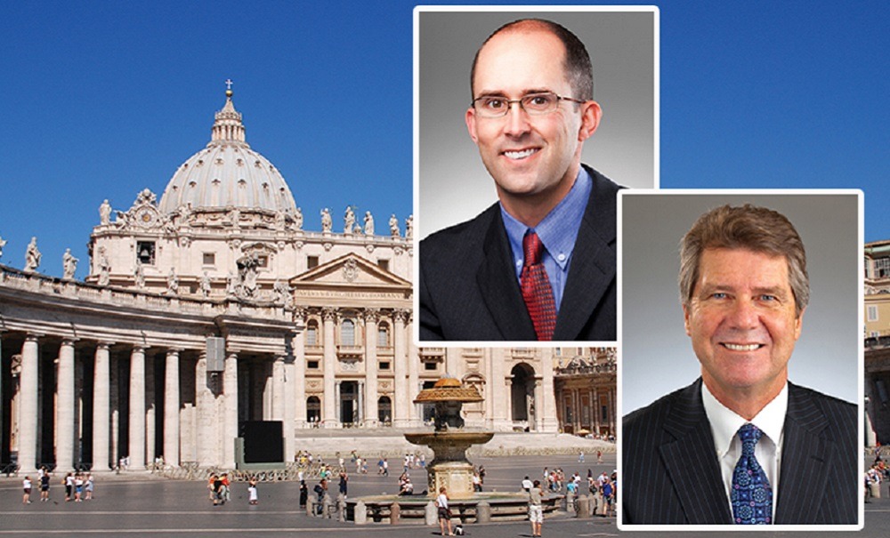 Jason Hurd and Mark Lundeen smile at camera in front of the Vatican.