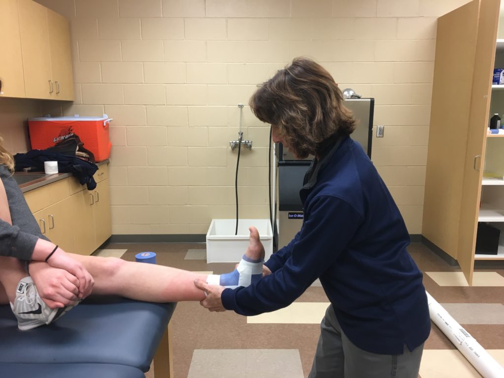 Athletic trainers work with athletes to reduce injury.