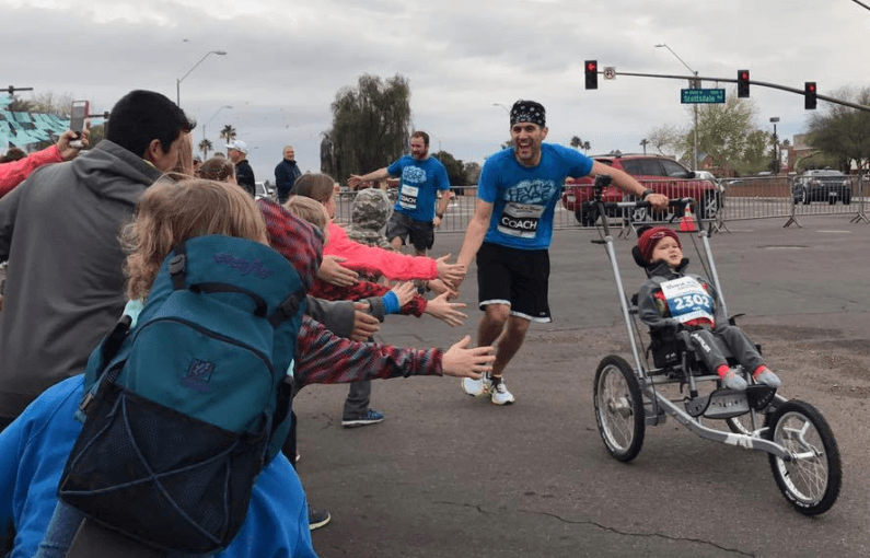 Dad races while pushing son with muscular dystrophy