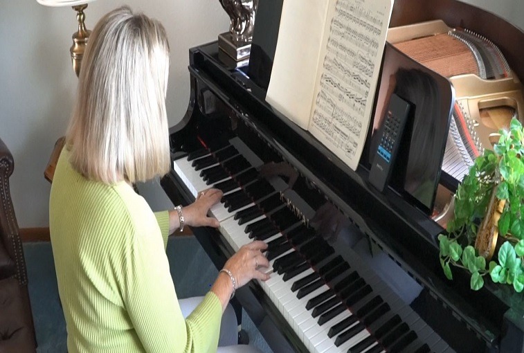 Kathleen Mangskau plays piano at her home in Bismarck, N.D. Prior to participating in the LSVT Big program, she wasn't able to play piano regularly.