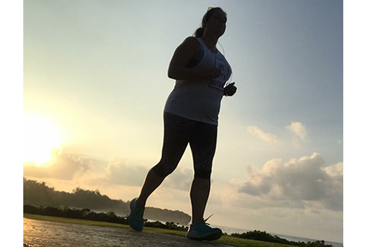 Linda Helgeson running against the sky