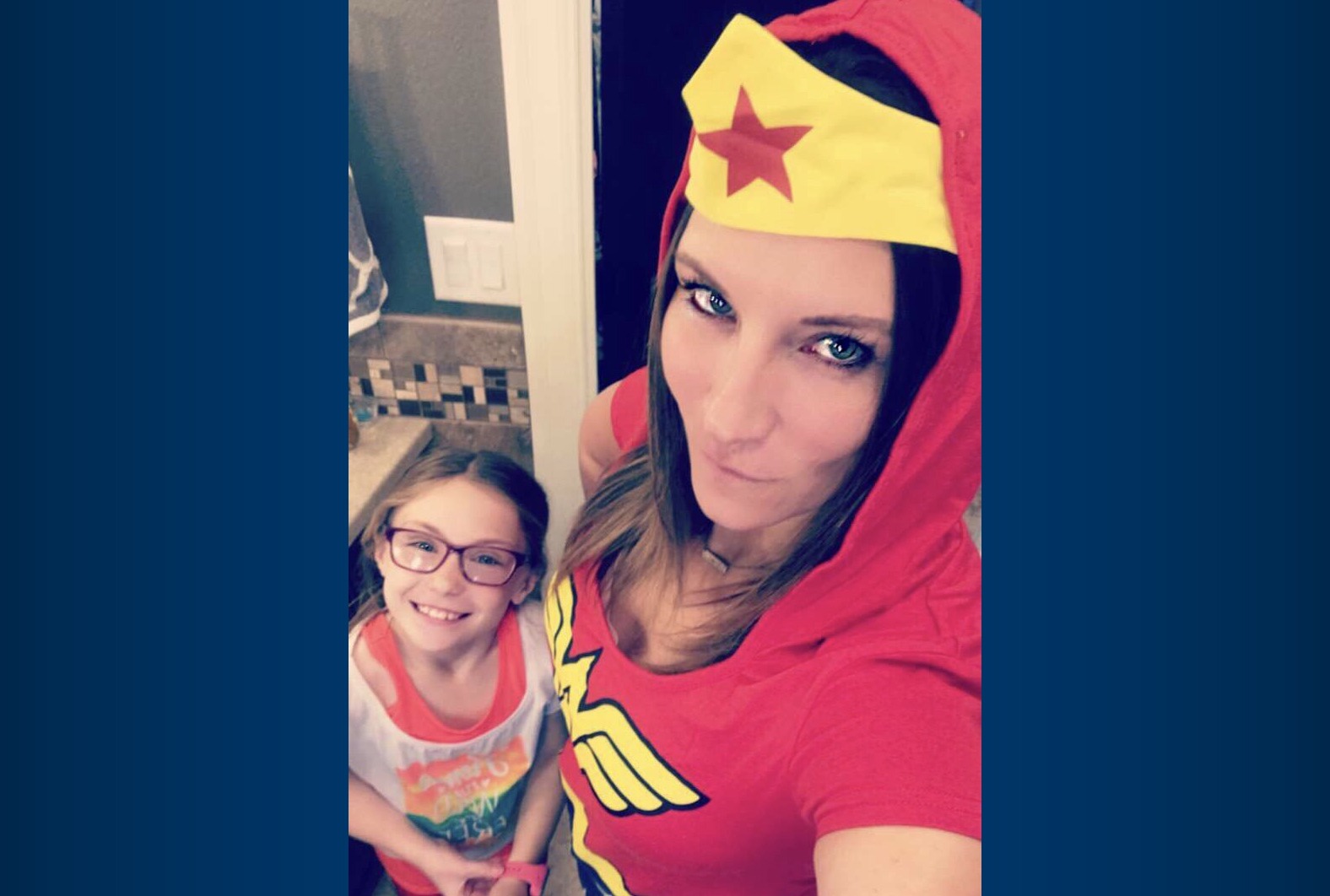 Kunkel wearing a Wonder Woman outfit for Halloween after learning of her breast cancer diagnosis, with her daughter.
