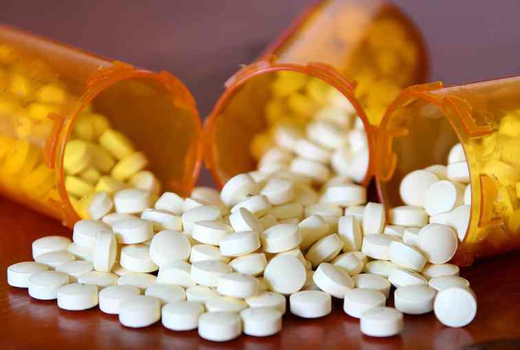 antibiotics spilling out of pill bottles