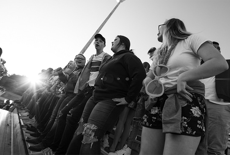 Students cheer on the C-Hawks from the student section during the Sept. 7 game.