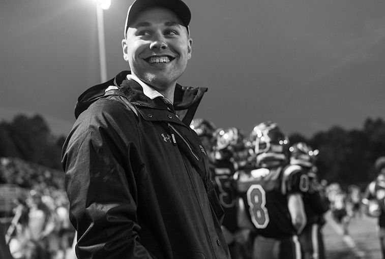 Sanford Health's Dan Hawley smiles with satisfaction on the sidelines on Sept. 28.