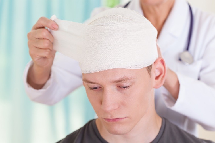 young man being treated for a concussion