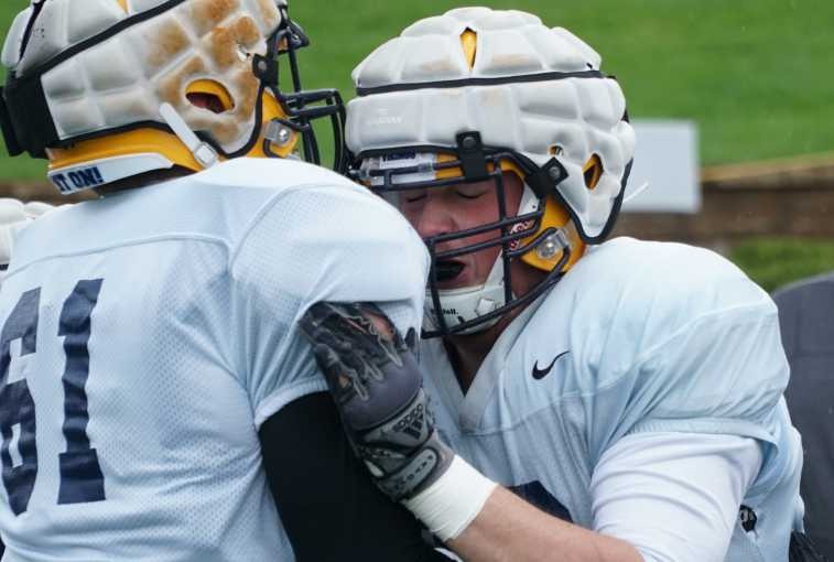 Two Augustana University offensive linemen drill during practice on Oct. 10, 2018, in Sioux Falls, S.D. 