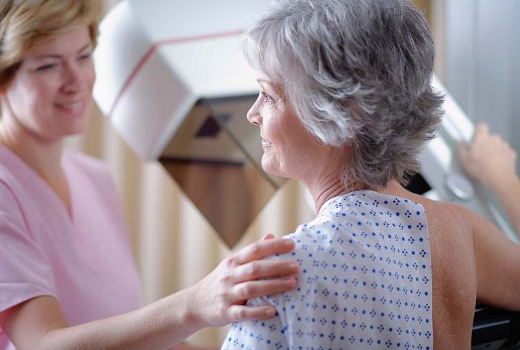 dense breast tissue: woman getting a mammogram