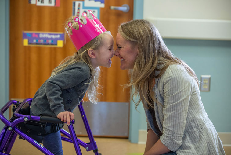 Avery Hill nuzzles noses with her mom, Mindy Hill, at Sanford Children's Hospital.