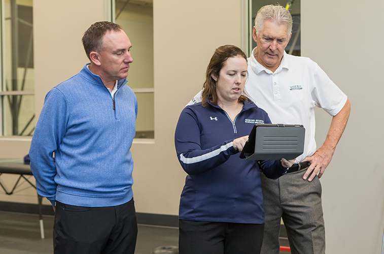 Sanford Health's Todd Kolb and Lisa MacFadden talk with Andy North (right), retired pro golfer, two-time U.S. Open Champion and chairman of the Sanford Health International Board. (Sanford Health photo)