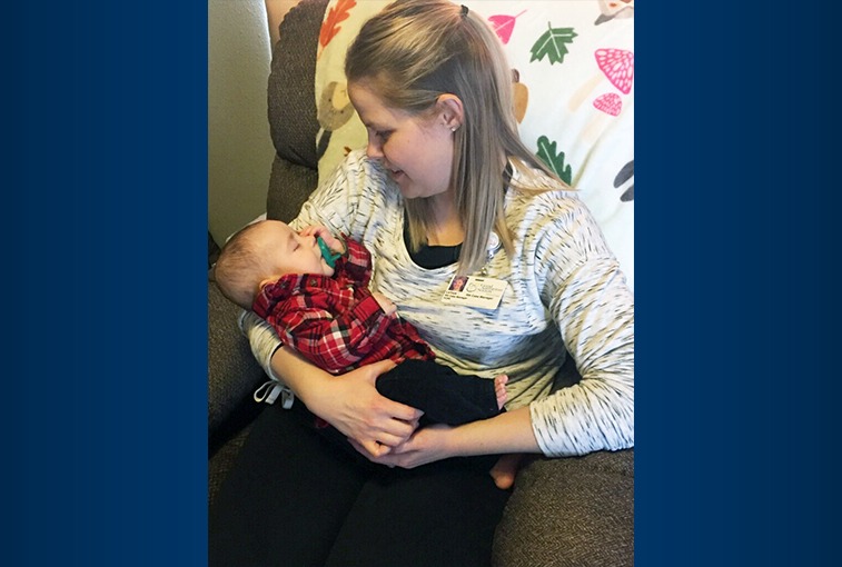 Good Samaritan Society home health nurse LaToya Buzalsky holds baby Murphy in his home. (Photos by Sanford Health.)