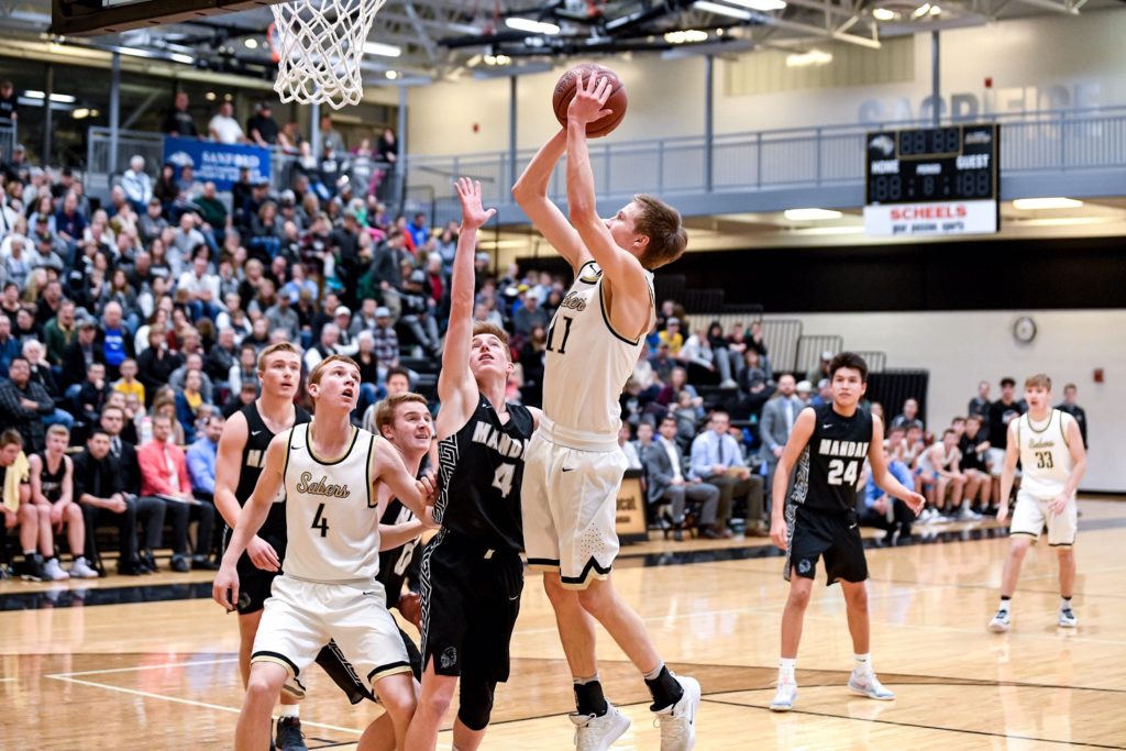 Male basketball player shooting