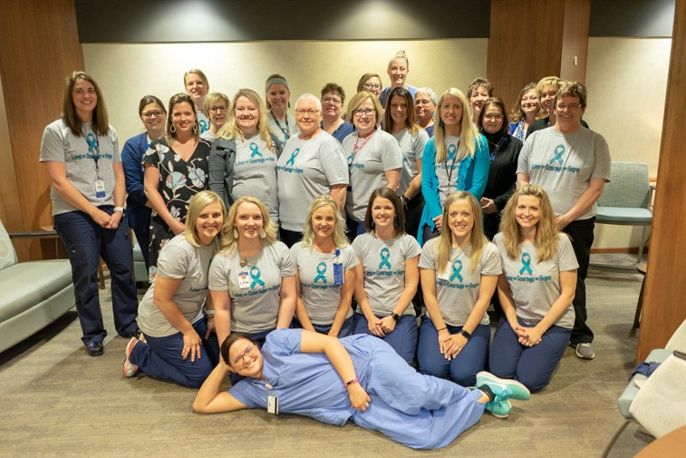Joan Muller (center) and a group of her co-workers gathered recently for a  photo at Sanford Obstetrics & Gynecology Clinic in Sioux Falls, S.D.