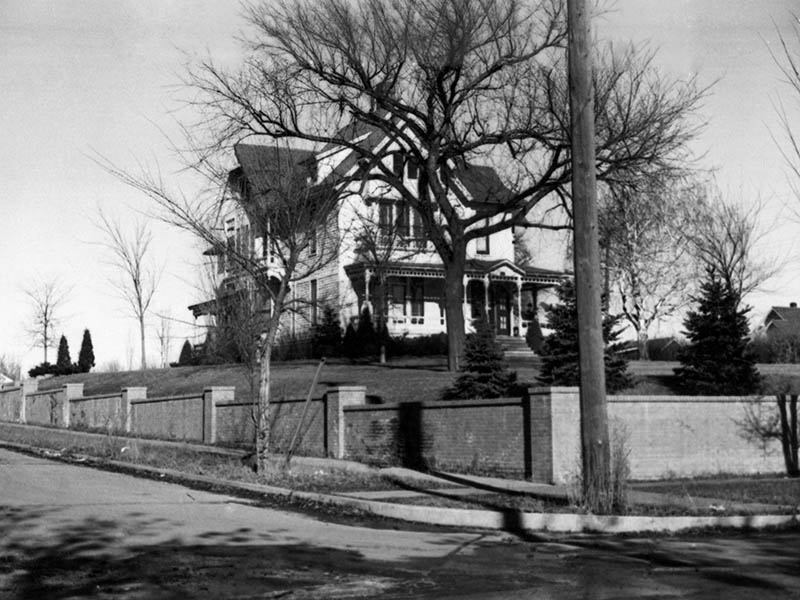A large house stands on a corner lot. This house served as the first hospital in Sioux Falls, South Dakota.