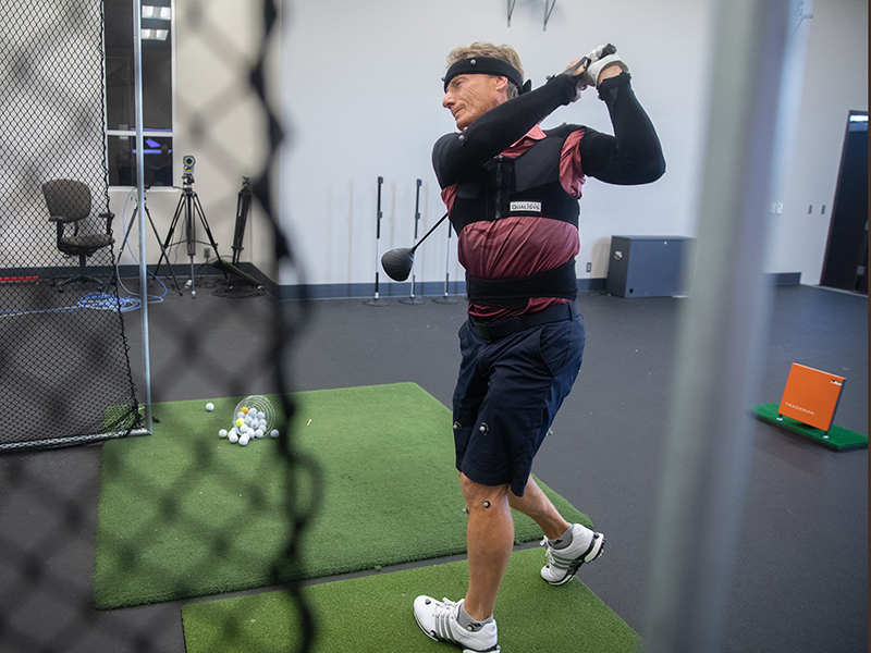 Bernhard Langer wears motion sensors while he takes a golf swing at Sanford Health.