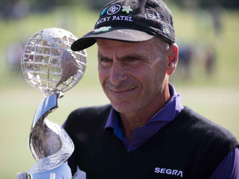 Rocco Mediate poses for photos after accepting the Sanford International trophy.