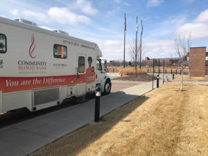 The bloodmobile sits in a parking lot. Blood donations are needed during the COVID-19 outbreak.