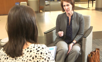 Dr. Allison Suttle speaks to a reporter about coronavirus preparation while sitting in the lobby of Sanford USD Medical Center.