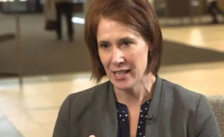 Dr. Allison Suttle talks about coronavirus while sitting in the lobby of a Sanford Health hospital.