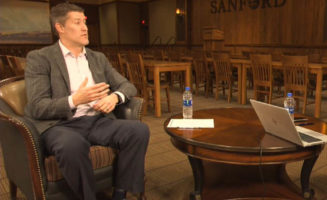 Dr. Jeremy Cauwels sits in a chair talking.