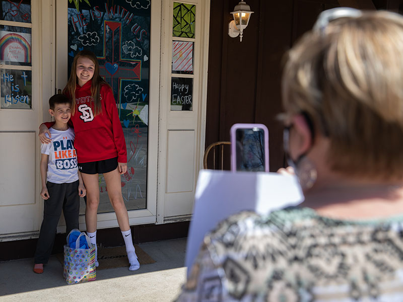 Lincoln and Ella, children of Sanford Health volunteer Erica Locke, discover the gift on their doorstep in honor of National Volunteer Week. (Photo by Jay Pickthorn, Sanford Health)