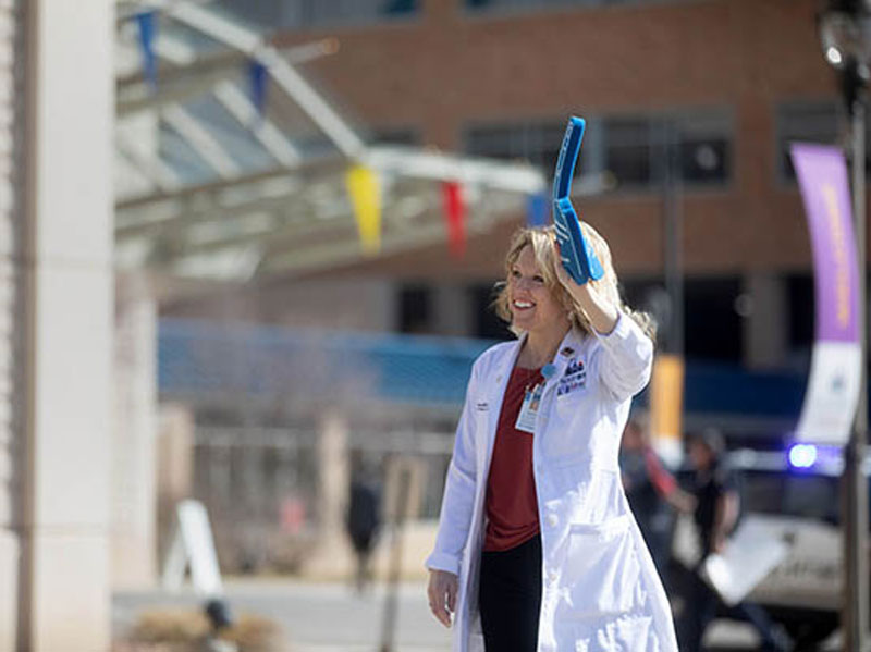 A doctor waves to her patients outside the children's hospital. (Photo by Jay Pickthorn, Sanford Health)