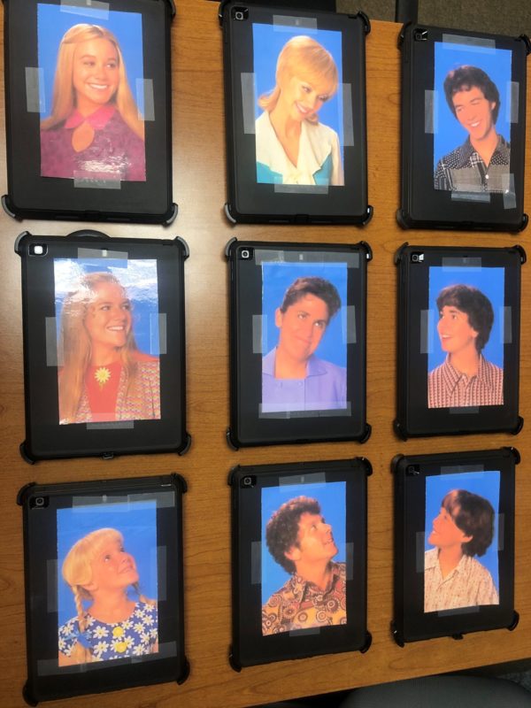 Nine iPads labeled with a character from American sitcom 'The Brady Bunch'