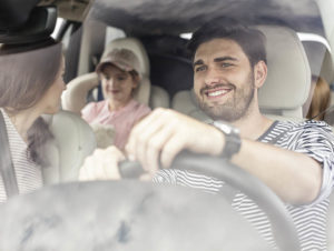 A family of four travels in a car