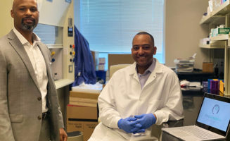 A portrait of Charles Cathlin and Tshaka Cunningham in a TruGenomix lab