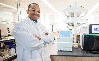 TruGenomix's Tshaka Cunningham stands in a lab