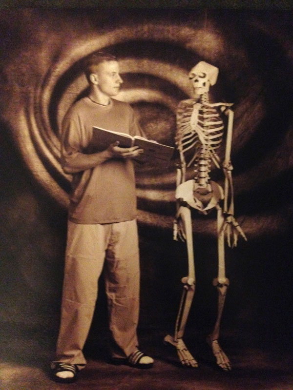 A Sanford surgeon poses with a skeleton in his high school senior photo.