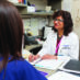 Dr. Anu Gaba talks with a nurse in an office