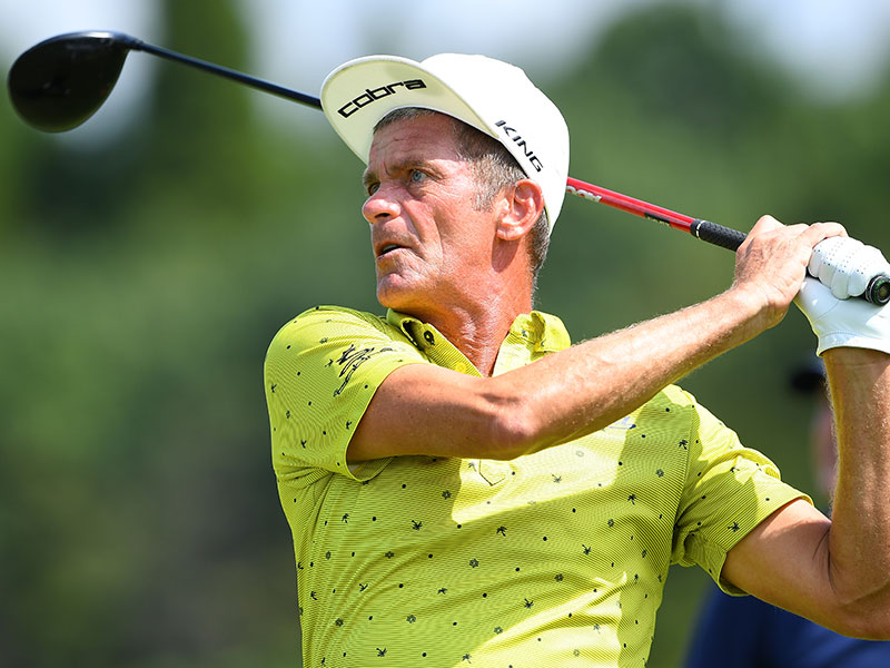 Jesper Parnevik wears an upturned cap on the golf course.