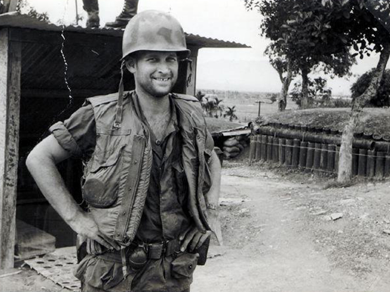 Good Samaritan Society resident as a young man in military uniform smiles for the camera during a tour in Vietnam.