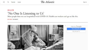 The Atlantic website screenshot with black and white photo of health care workers in full PPE, weeping at a hospital bedside, with headline "'No one is listening to us'"