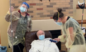Society resident receiving monoclonal antibody therapy.