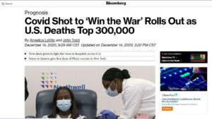 Bloomberg website screenshot with masked nurse leaning over to give vaccine to a masked health care worker, under headline "Covid Shot to ‘Win the War’ Rolls Out as U.S. Deaths Top 300,000"