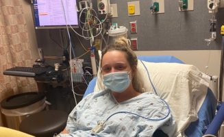 Alyssa Bossman in hospital bed awaiting surgery.