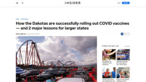 Screen shot of Business Insider website with cars lined up in amusement park parking lot under headline "How the Dakotas are successfully rolling out COVID vaccines — and 2 major lessons for larger states"
