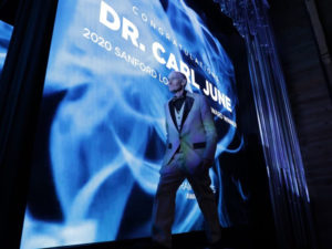 Dr. June accepting his award.