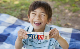 boy holding blocks