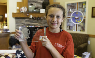 Young volunteer paints nails, brings pony to see residents