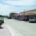 Cars and trucks are parked outside a Ben Franklin store and other small shops in downtown Sheldon, Iowa.