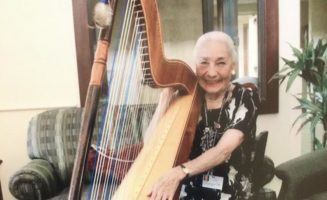 87-year-old harpist plays for patients in hospice