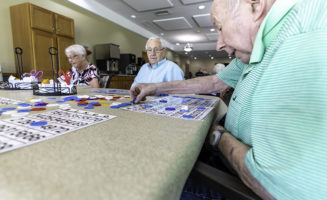 seniors play bingo in retirement home